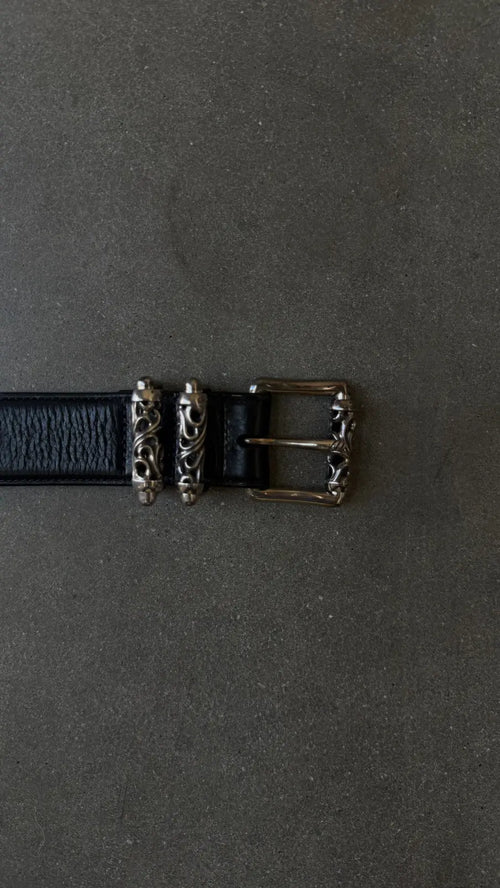 Top view of Chrome Hearts 3-Piece Roller Belt featuring engraved silver hardware and textured black leather. Perfect for stylish outfits in size 34.
